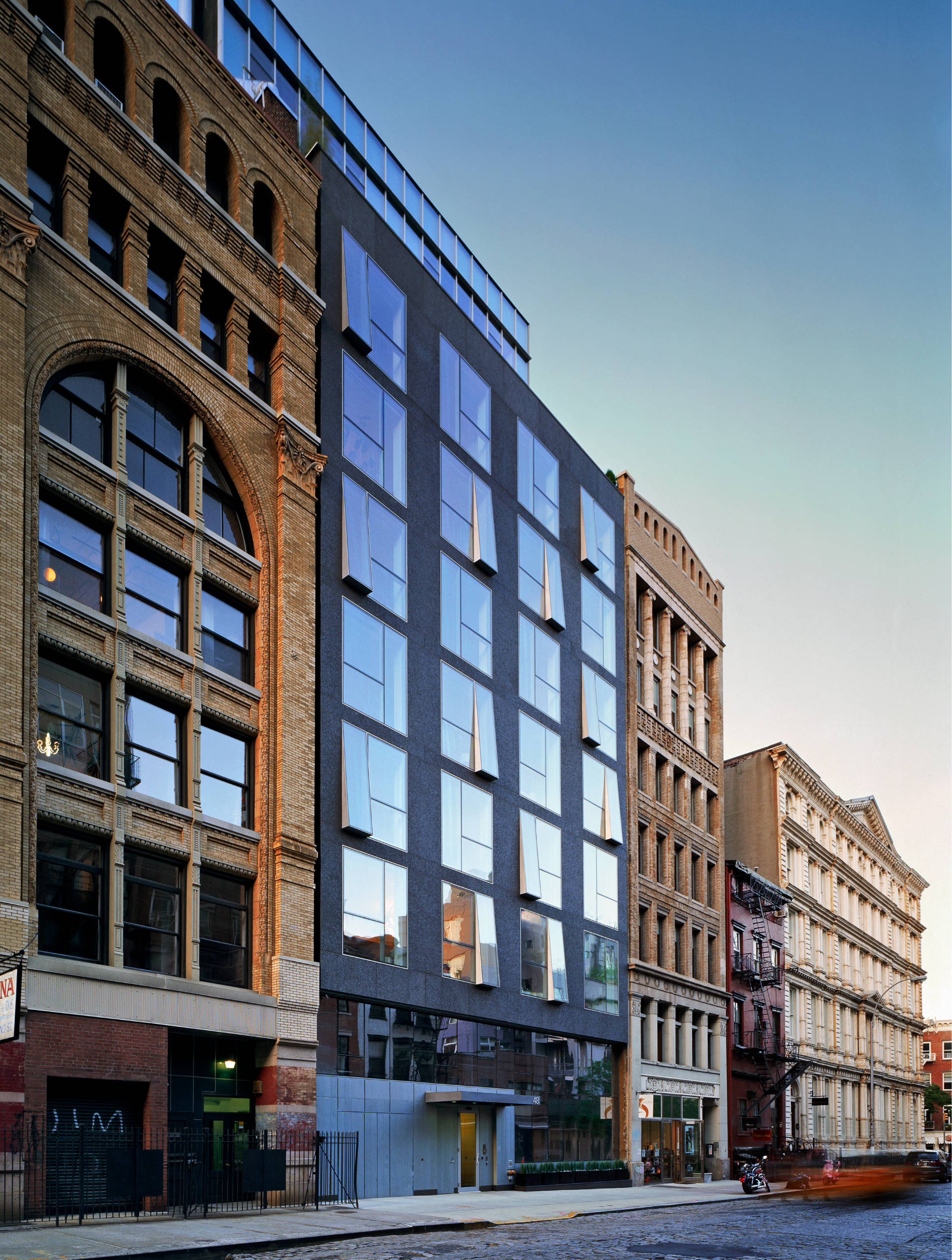 48 Bond Street building facade at dusk.